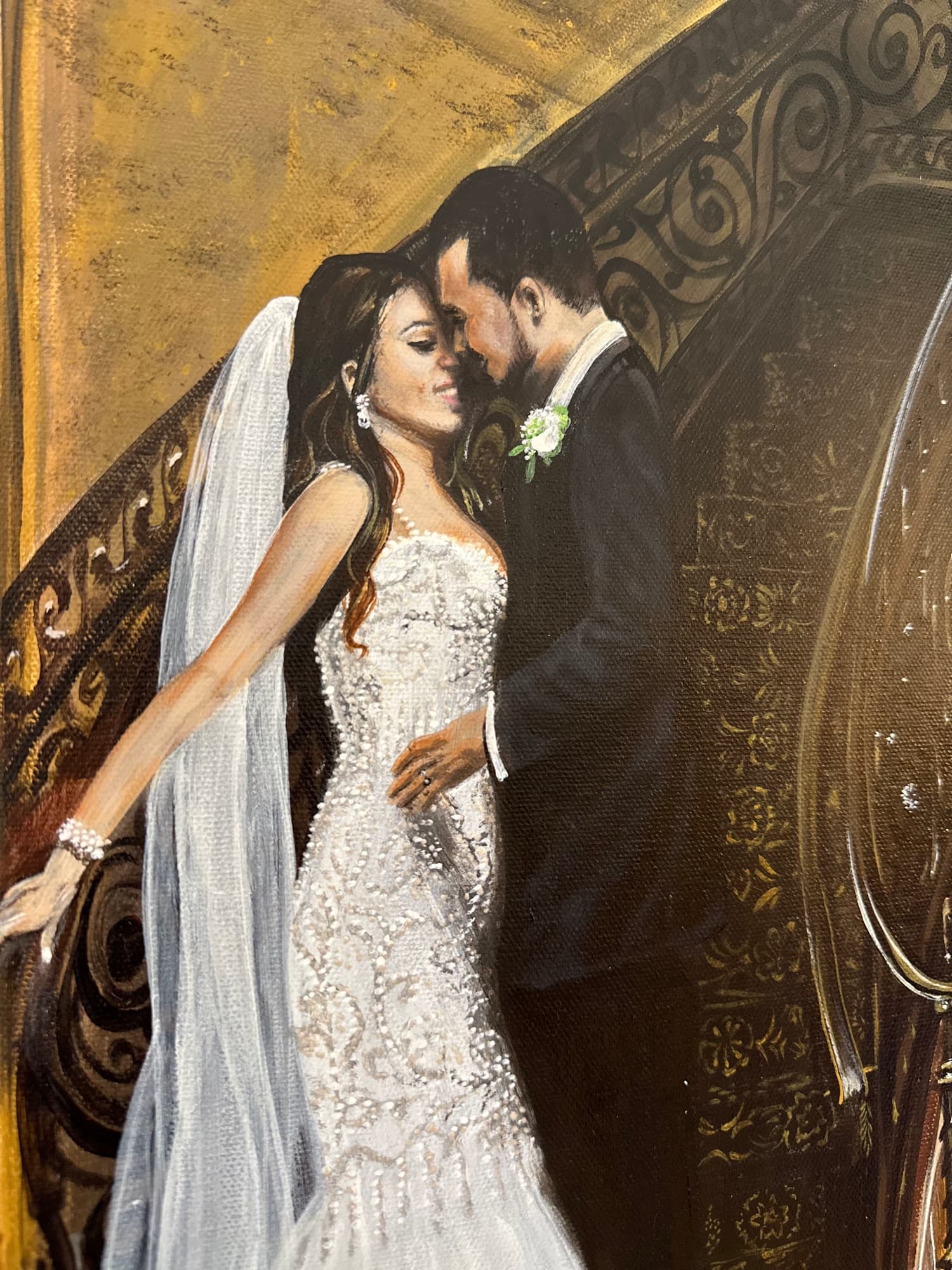 Close detail of the bride and groom from the grand staircase painting — beaded gown, veil, and boutonniere