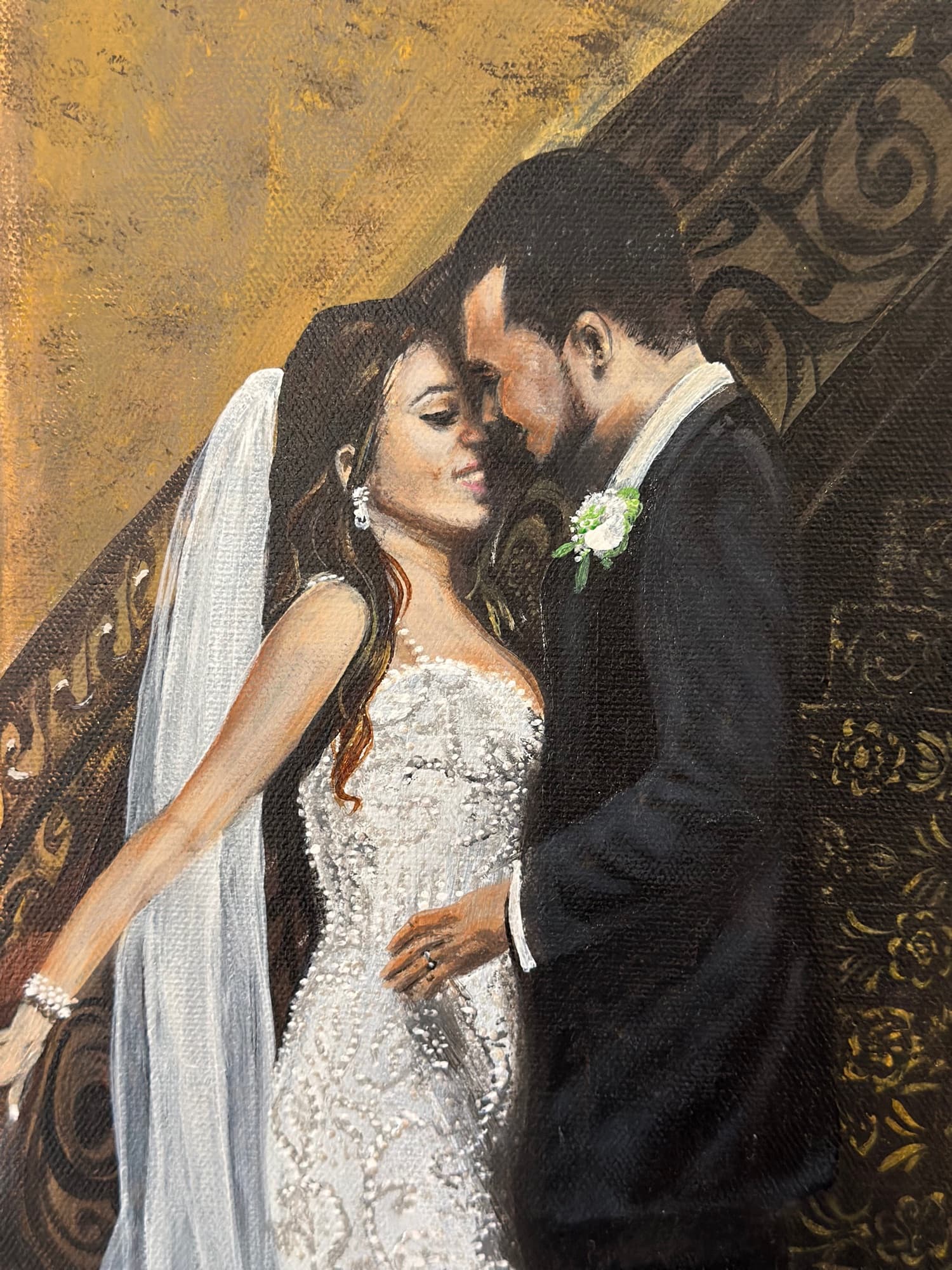 Tighter detail of the bride and groom embracing — facial expressions and the curve of the veil