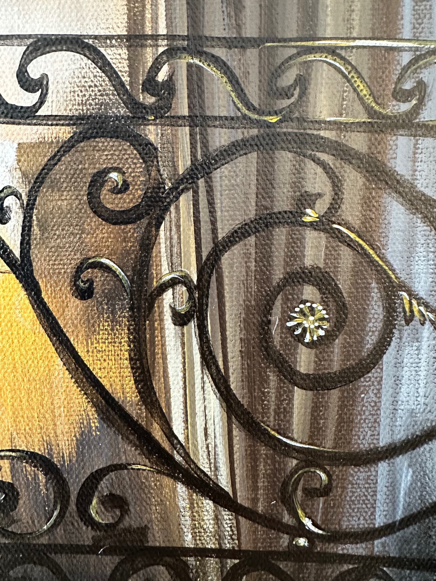 Detail of a single ornamental medallion within the wrought iron of the staircase painting